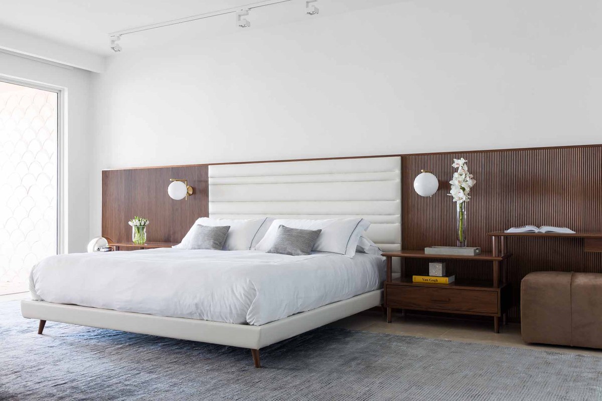 Bedroom in a Fisher Island beach home by Hinojosa Design Studio