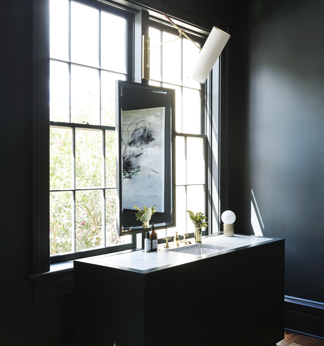 Dark Bathroom with Brass Accents by Workstead