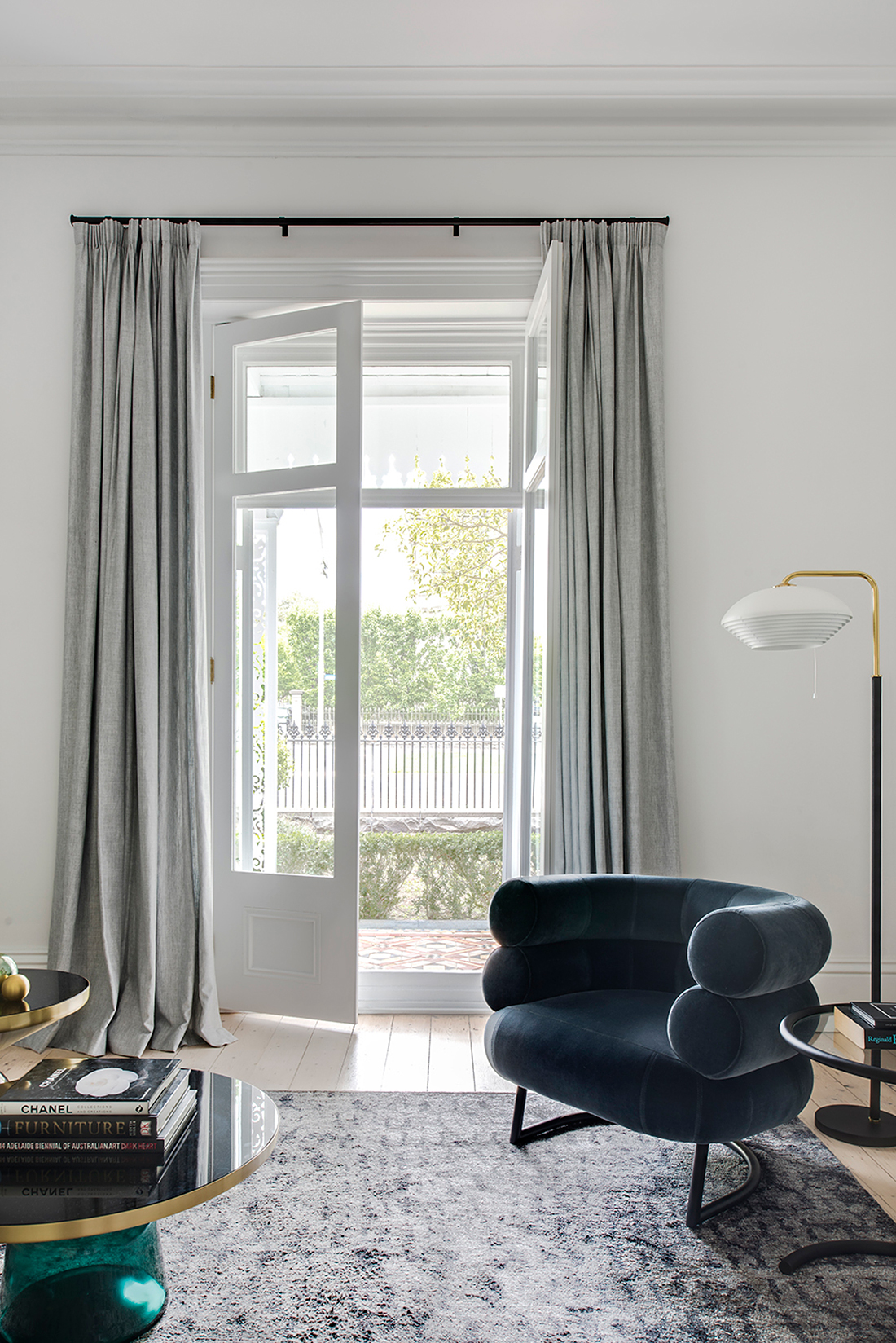 Living Room With Velvet Bibendum chair by Eileen Gray