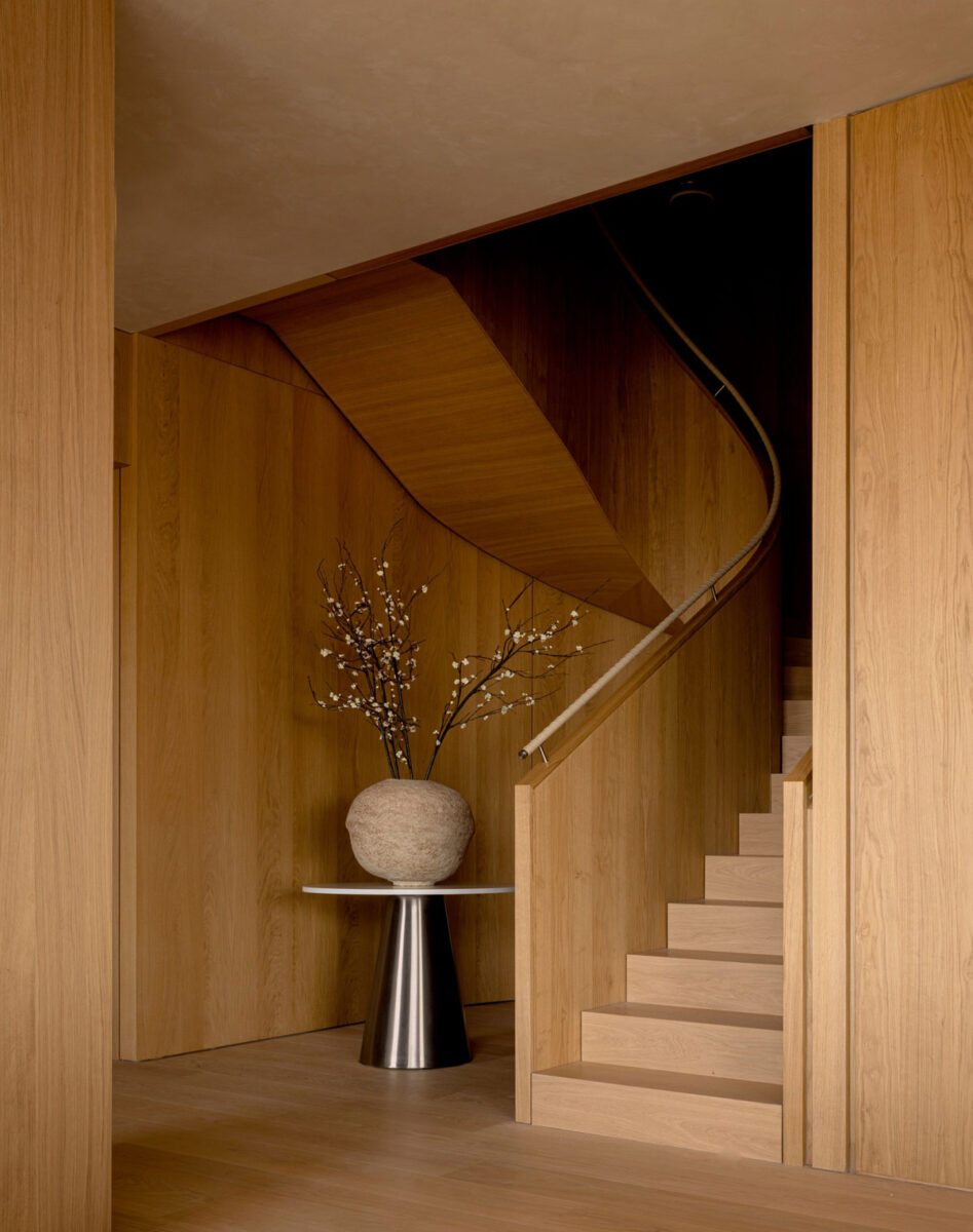 Sculptural interior staircase with natural wood detailing at 262 Fifth Avenue