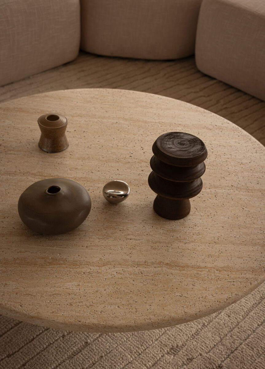 Low round coffee table in natural off white stone