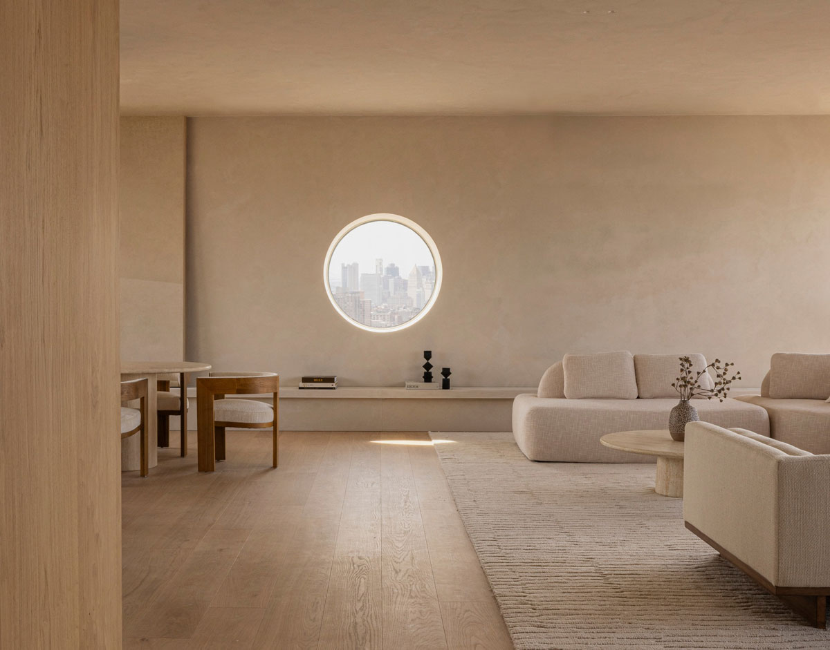 262 Fifth Avenue interior with sculptural round window and warm natural wood finishes