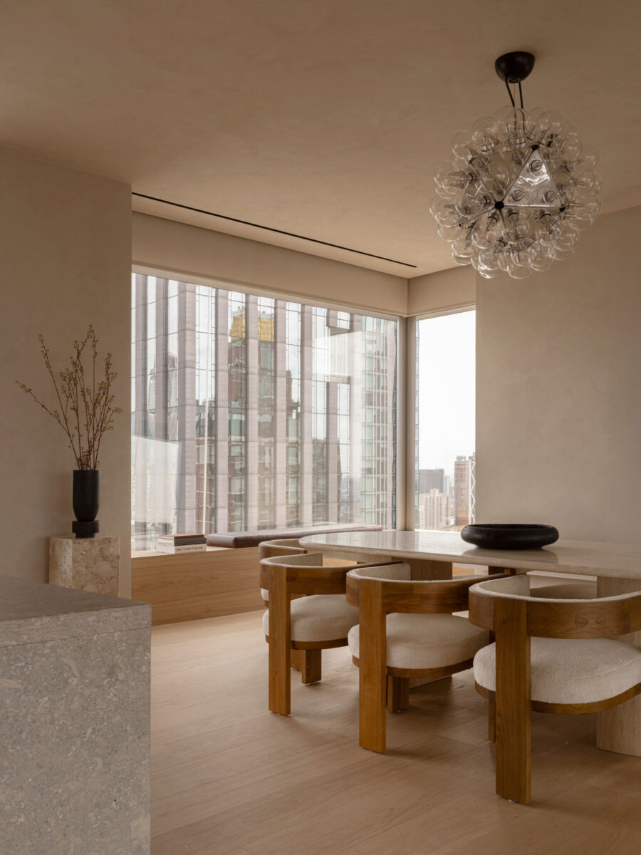 Contemporary dining room at 262 Fifth Avenue with sculptural furniture, natural oak and panoramic city views