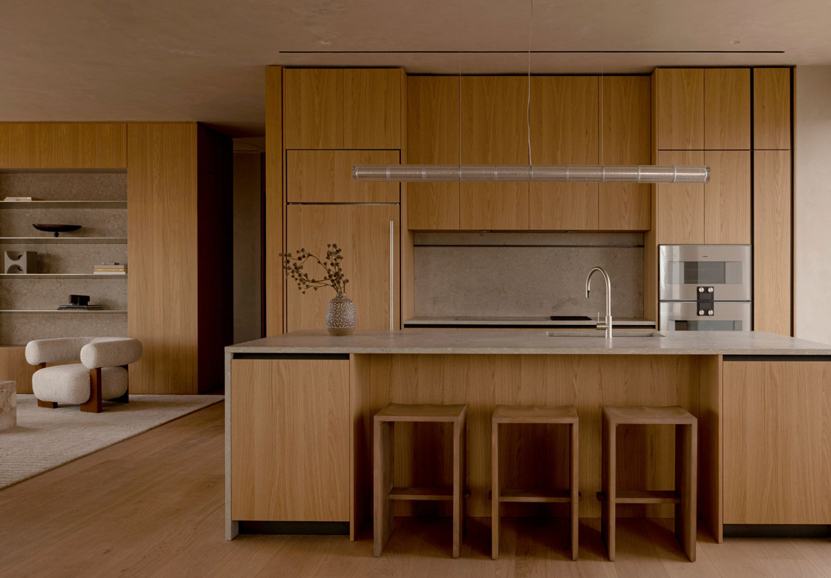 Norm Architects kitchen design at 262 Fifth Avenue with warm oak cabinetry and stone surfaces