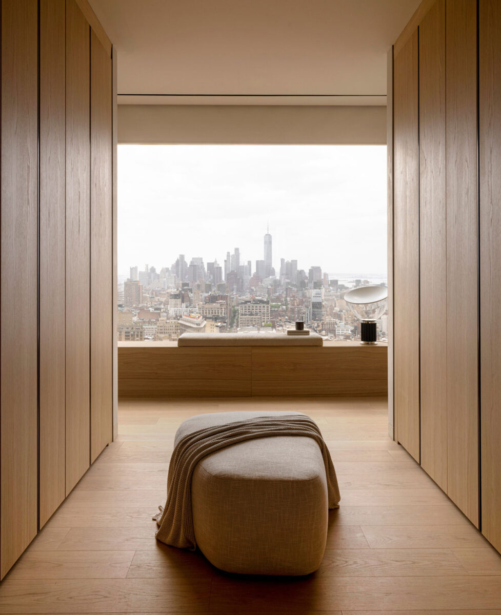 Minimalist luxury closet corridor with warm wood and natural materials