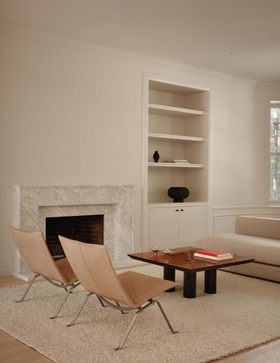 Westmount home living room with pale oak floors, fireplace and custom built-in cabinetry