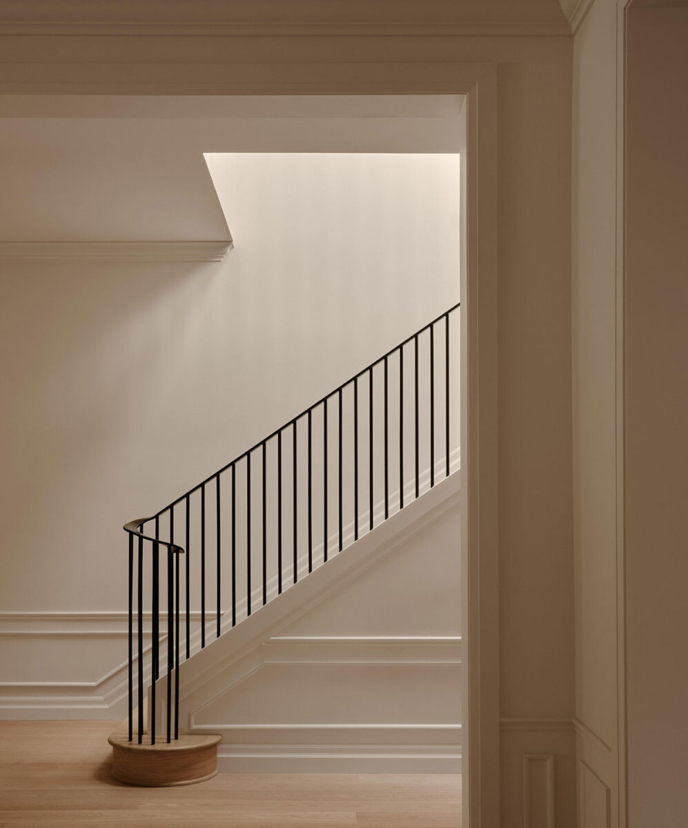 Wood Residence main staircase with white oak flooring and black steel handrail in Westmount Montreal